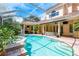 A stunning outdoor screened-in pool and spa area, perfect for relaxation and entertainment at 3042 Wentworth Way, Tarpon Springs, FL 34688