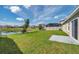 Lush backyard featuring a pond view and private screened-in pool at 30732 Summer Sun Loop, Wesley Chapel, FL 33545