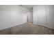 Clean bedroom showcasing carpet flooring and neutral paint color at 30732 Summer Sun Loop, Wesley Chapel, FL 33545