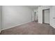 Bedroom featuring neutral carpet, baseboards, and a closet for storage at 30732 Summer Sun Loop, Wesley Chapel, FL 33545