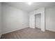 Empty bedroom featuring neutral carpet, baseboards, and a closet for storage at 30732 Summer Sun Loop, Wesley Chapel, FL 33545