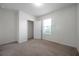 Cozy bedroom with carpet flooring, closet, and ample natural light at 30732 Summer Sun Loop, Wesley Chapel, FL 33545