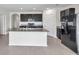 Modern kitchen with a large island, stainless steel appliances, and granite countertops at 30732 Summer Sun Loop, Wesley Chapel, FL 33545
