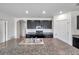 Close-up of kitchen island with granite countertops and stainless steel sink at 30732 Summer Sun Loop, Wesley Chapel, FL 33545