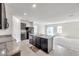 Bright, open-concept kitchen featuring a large island with granite countertops and modern appliances at 30732 Summer Sun Loop, Wesley Chapel, FL 33545