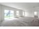 Bright and spacious living room with sliding glass doors providing serene views of the outdoors at 30732 Summer Sun Loop, Wesley Chapel, FL 33545