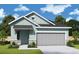 Charming single-story home featuring a two-car garage and tasteful stone accents at 31172 Pendleton Landing Cir, Wesley Chapel, FL 33545