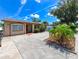 Charming single-story house with a well-maintained lawn and spacious driveway at 3303 W Idlewild Ave, Tampa, FL 33614