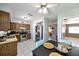 A kitchen and dining area with tile floors, wooden cabinets, and stainless steel appliances are inviting and practical at 3303 W Idlewild Ave, Tampa, FL 33614