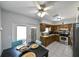 Eat-in kitchen with stainless steel appliances, and a view of the breakfast nook with a table and chairs at 3303 W Idlewild Ave, Tampa, FL 33614