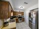 The kitchen features stainless steel appliances and tile floors for easy maintenance and cleaning at 3303 W Idlewild Ave, Tampa, FL 33614