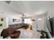 Inviting living room with tile flooring, neutral walls, and a comfortable sectional sofa at 3303 W Idlewild Ave, Tampa, FL 33614