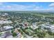 This high-angle shows the property's location with city views and lush trees at 3807 W Cleveland St, Tampa, FL 33609