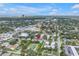 This high-angle shows the property's location with city views and lush trees at 3807 W Cleveland St, Tampa, FL 33609