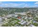 This high-angle shows the property's location with city views and lush trees at 3807 W Cleveland St, Tampa, FL 33609