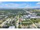 A high-angle shows the property's location with city views and lush trees at 3807 W Cleveland St, Tampa, FL 33609