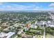 Aerial view of the townhome nestled in a neighborhood with a nearby ocean in the distance at 3807 W Cleveland St, Tampa, FL 33609