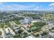 A high-angle shows the property's location with city views and lush trees at 3807 W Cleveland St, Tampa, FL 33609