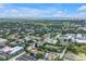 A high-angle shows the property's location with city views and lush trees at 3807 W Cleveland St, Tampa, FL 33609