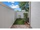 Enclosed patio with small bushes and a privacy fence at 3807 W Cleveland St, Tampa, FL 33609
