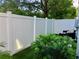 Fenced backyard with artificial turf, providing a private outdoor space for relaxation at 3807 W Cleveland St, Tampa, FL 33609