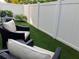 A cozy backyard with artificial turf and outdoor seating provides a serene retreat at 3807 W Cleveland St, Tampa, FL 33609