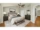 Serene bedroom with a ceiling fan, neutral color palette, and minimalist decor, offering a tranquil atmosphere at 3807 W Cleveland St, Tampa, FL 33609