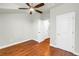 This spacious bedroom features hardwood floors and a ceiling fan at 3807 W Cleveland St, Tampa, FL 33609
