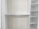 Well-organized closet featuring white shelving, chrome bars for hangers, and plenty of storage space at 3807 W Cleveland St, Tampa, FL 33609