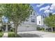 This image displays an exterior view of well-manicured townhomes at 3807 W Cleveland St, Tampa, FL 33609