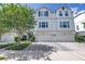 A charming townhome with a paved driveway and well-maintained landscaping at 3807 W Cleveland St, Tampa, FL 33609