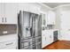 Well-equipped kitchen features stainless steel appliances, white cabinets, and sleek countertops at 3807 W Cleveland St, Tampa, FL 33609