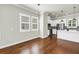 Hardwood floors in the living room leading to the kitchen at 3807 W Cleveland St, Tampa, FL 33609