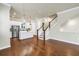 Open-concept living room with kitchen and hardwood floors at 3807 W Cleveland St, Tampa, FL 33609