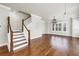 Living room staircase with hardwood floors and lots of light at 3807 W Cleveland St, Tampa, FL 33609
