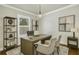 Well-lit office featuring a modern desk, comfortable seating, and ample natural light for a productive workspace at 3807 W Cleveland St, Tampa, FL 33609