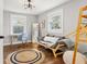 Comfortable bedroom with hardwood floors, neutral tones, and natural light at 403 E North St, Tampa, FL 33604