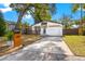 Charming single-Gathering home with a well-manicured lawn and a cozy front porch at 403 E North St, Tampa, FL 33604