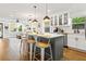 Spacious kitchen with island, stainless steel appliances, and open to the living room at 403 E North St, Tampa, FL 33604