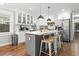 Stylish kitchen with island, stainless steel appliances, and white cabinetry at 403 E North St, Tampa, FL 33604