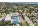 An aerial view shows the property's proximity to a school with a pool at 4101 Shore Acres Ne Blvd, St Petersburg, FL 33703