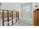 Bathroom is under construction with white tile and tub, gray tile floor, and a window at 4101 Shore Acres Ne Blvd, St Petersburg, FL 33703