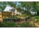 Exterior view of home showing fenced backyard and landscaping at 4167 Seton Cir, Palm Harbor, FL 34683
