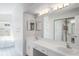 Bright bathroom featuring double sinks, a tub and windows at 4167 Seton Cir, Palm Harbor, FL 34683