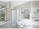 Modern bathroom with walk-in shower and soaking tub at 4167 Seton Cir, Palm Harbor, FL 34683