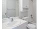 Bathroom with white vanity, toilet, shower and mirrored medicine cabinet at 4167 Seton Cir, Palm Harbor, FL 34683
