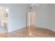 Open bedroom featuring hardwood floors, ensuite bath and walk-in closet at 4167 Seton Cir, Palm Harbor, FL 34683