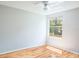 Bedroom with wood floors and large window providing natural light at 4167 Seton Cir, Palm Harbor, FL 34683