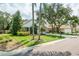 Beautifully landscaped front yard featuring mature trees and manicured grass at 4167 Seton Cir, Palm Harbor, FL 34683