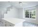 Open kitchen boasts island, bright lighting, and a neutral color palette at 4167 Seton Cir, Palm Harbor, FL 34683